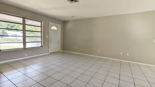 entryway featuring light tile patterned floors