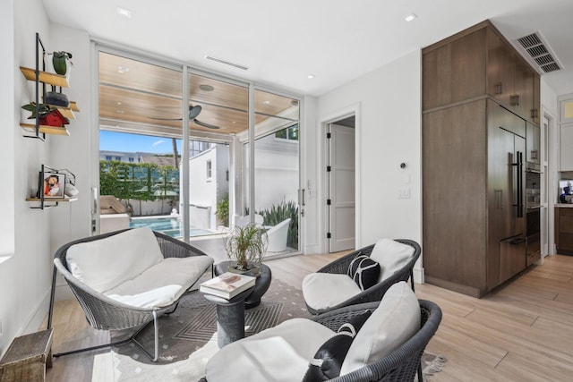 living area with light hardwood / wood-style flooring