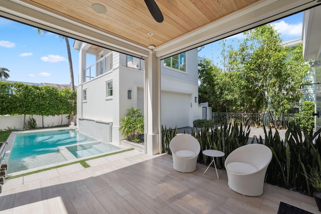 sunroom / solarium with wooden ceiling and ceiling fan