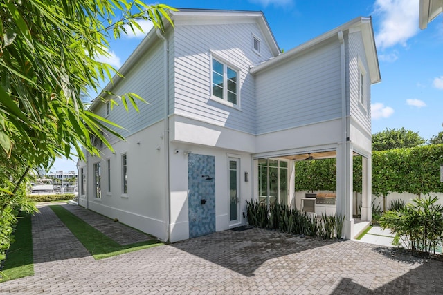 back of house with a patio