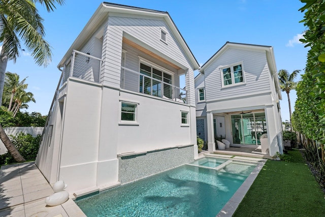 rear view of property featuring a patio