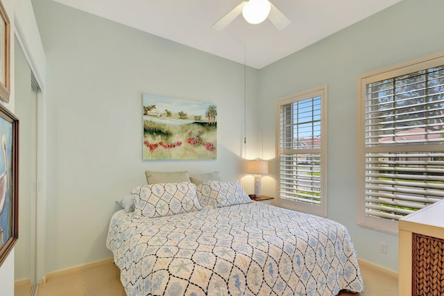 carpeted bedroom featuring ceiling fan