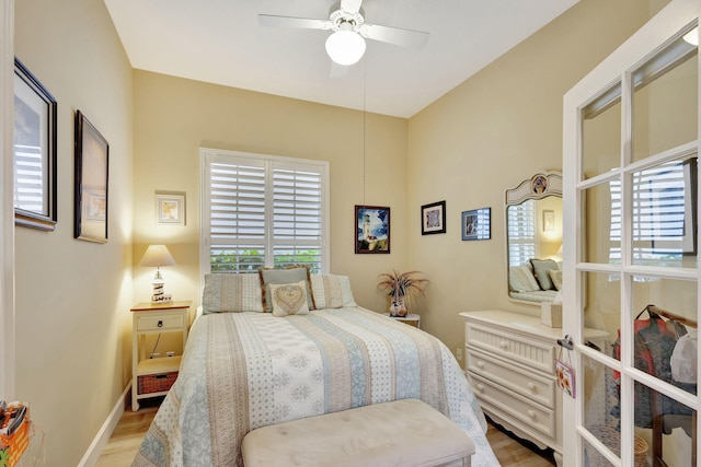 bedroom with light hardwood / wood-style flooring and ceiling fan