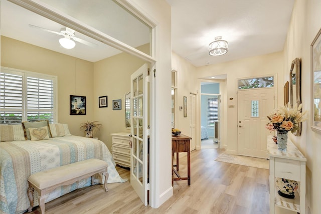 bedroom featuring light wood-type flooring and ceiling fan