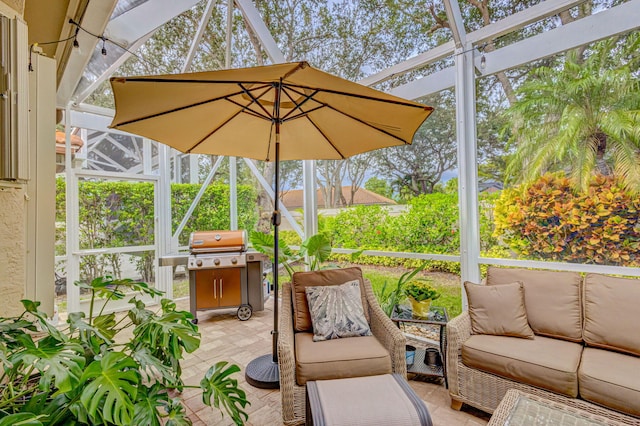 exterior space featuring outdoor lounge area and glass enclosure