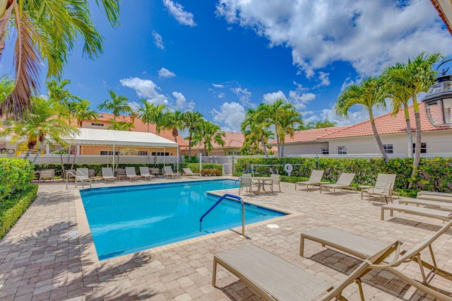 view of swimming pool with a patio area