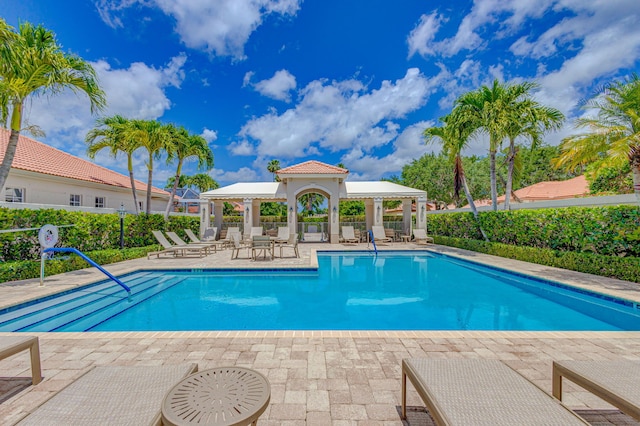 view of pool featuring a gazebo and a patio