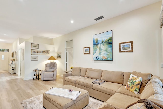 living room with light hardwood / wood-style flooring