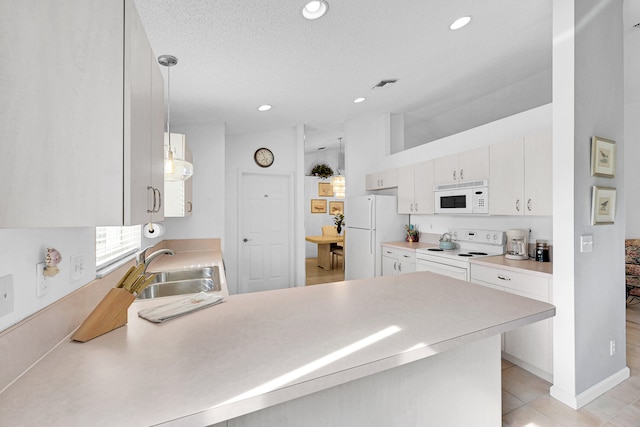 kitchen with kitchen peninsula, hanging light fixtures, white cabinetry, sink, and white appliances