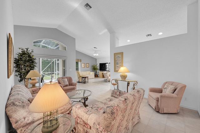 living room featuring light tile patterned flooring, a textured ceiling, high vaulted ceiling, and ceiling fan