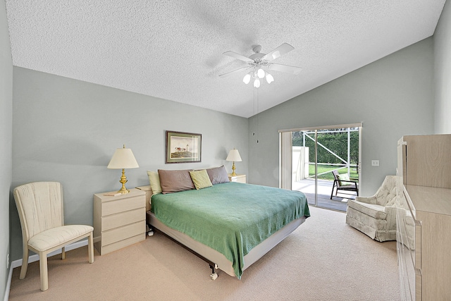 carpeted bedroom featuring access to outside, lofted ceiling, a textured ceiling, and ceiling fan