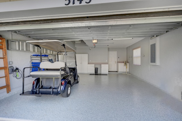 garage with electric panel and a garage door opener