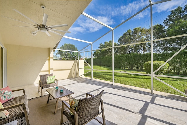 view of patio with a lanai and ceiling fan