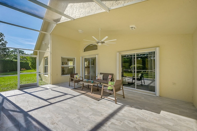 view of patio / terrace featuring a lanai and ceiling fan