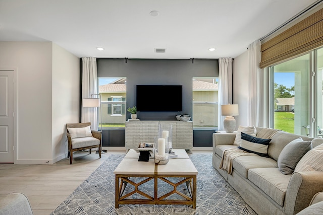 living room with light hardwood / wood-style floors