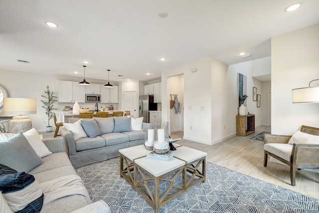 living room with light hardwood / wood-style floors