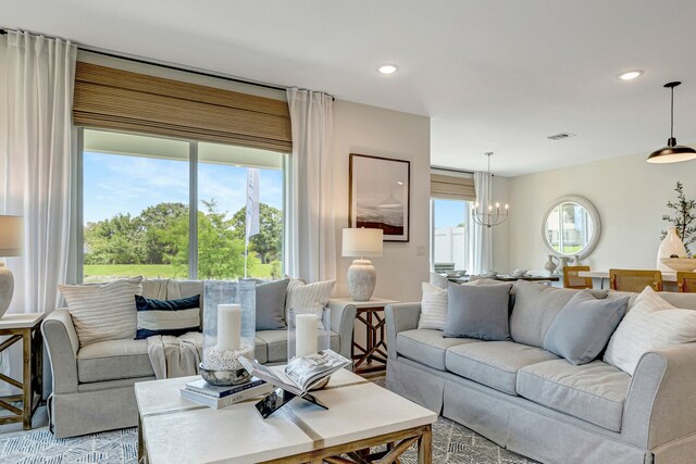 living room with an inviting chandelier