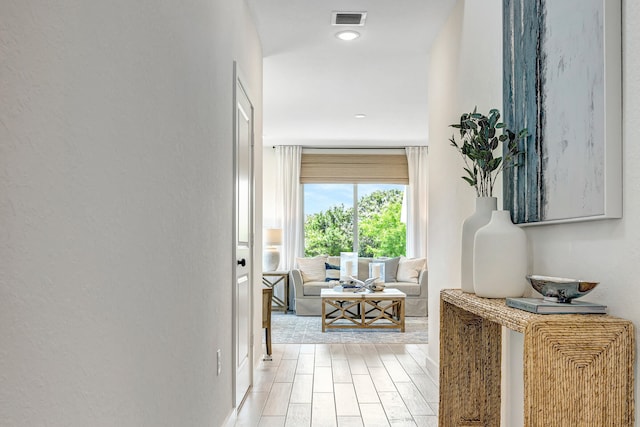 hallway featuring light hardwood / wood-style flooring