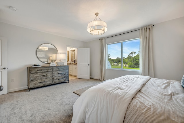 carpeted bedroom featuring connected bathroom