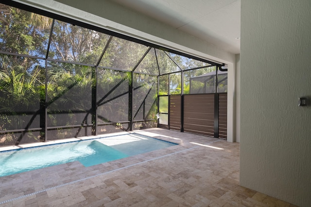 view of pool featuring a patio area and a lanai