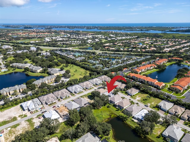 birds eye view of property featuring a water view