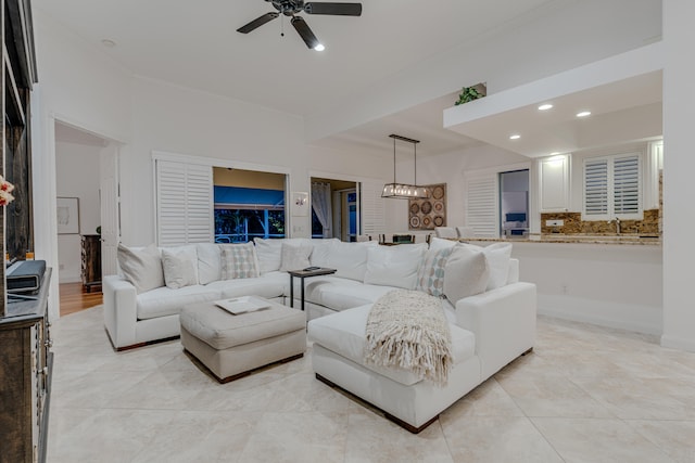 living room with sink and ceiling fan