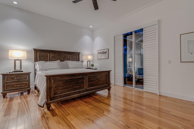 bedroom with access to exterior, light wood-type flooring, and ceiling fan