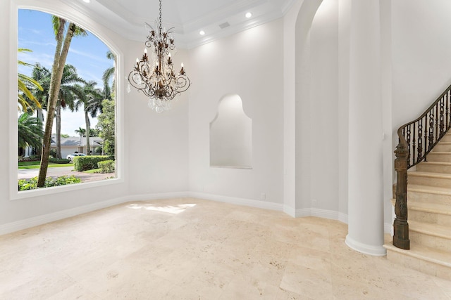 unfurnished room featuring baseboards, crown molding, stairs, and a high ceiling