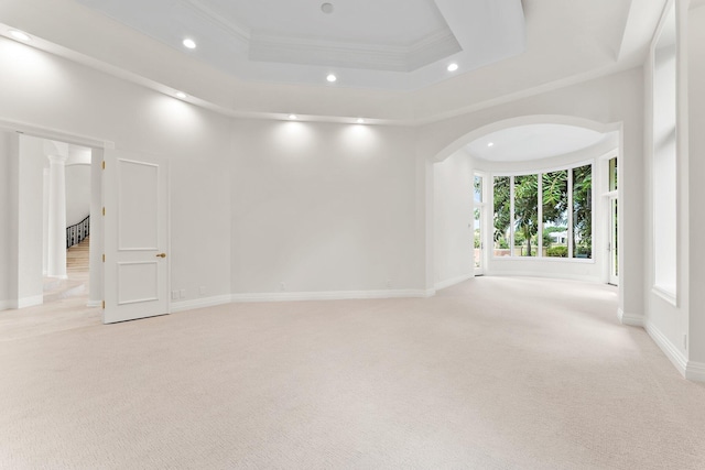 empty room featuring recessed lighting, crown molding, and light colored carpet