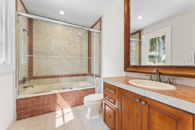 full bathroom featuring tile patterned floors, toilet, recessed lighting, vanity, and tiled shower / bath