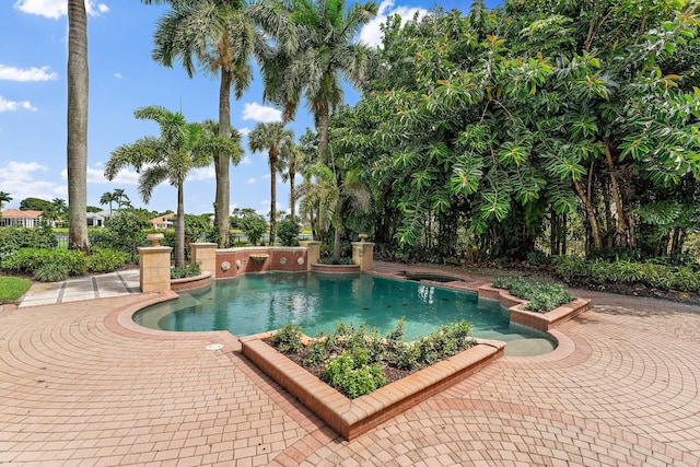 pool with an in ground hot tub