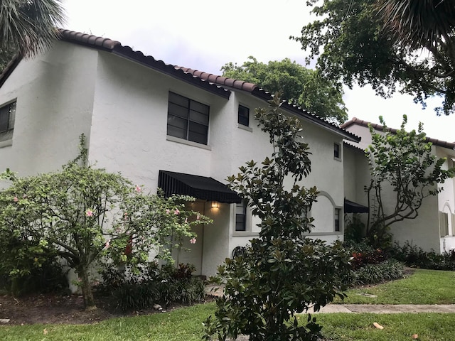 view of home's exterior featuring a yard