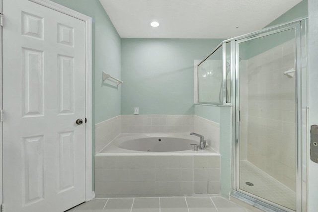 bathroom with independent shower and bath and tile patterned floors