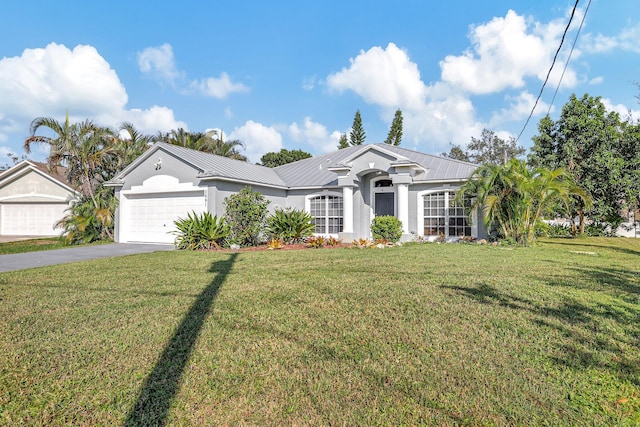 ranch-style house with a front yard and a garage