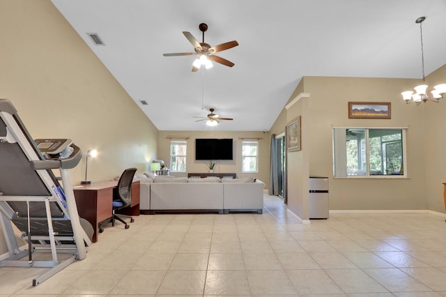 living room with a healthy amount of sunlight, light tile patterned flooring, and high vaulted ceiling