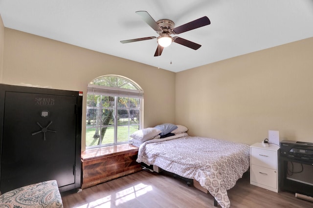 bedroom featuring ceiling fan and wood-type flooring