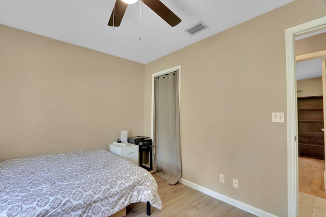 bedroom featuring light hardwood / wood-style flooring and ceiling fan