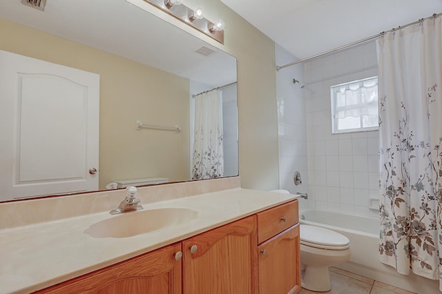 full bathroom with tile patterned floors, vanity, shower / tub combo, and toilet