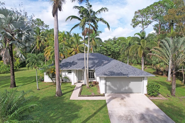 single story home with a garage and a front yard