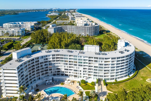 drone / aerial view featuring a water view and a beach view