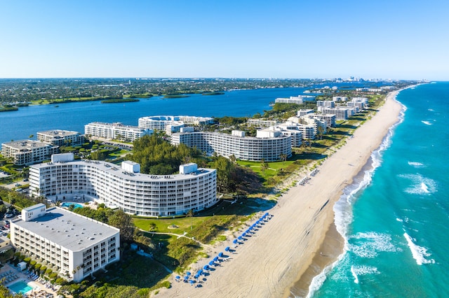 aerial view featuring a water view and a beach view