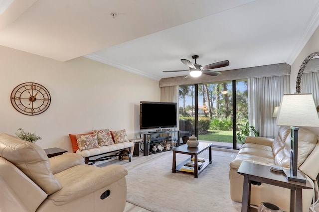 living room with ornamental molding and ceiling fan