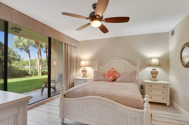 bedroom featuring ceiling fan, light wood-type flooring, and access to exterior