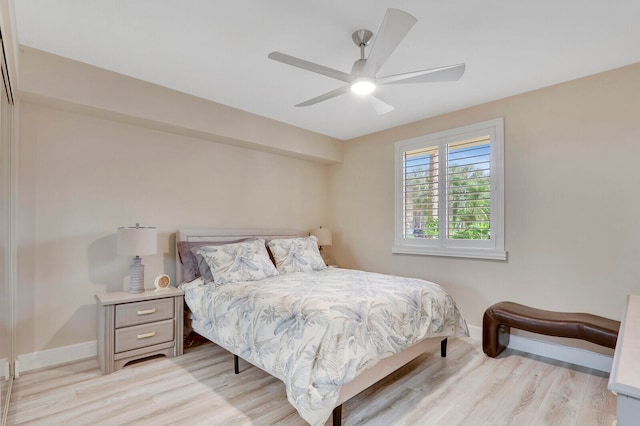 bedroom with light hardwood / wood-style flooring and ceiling fan