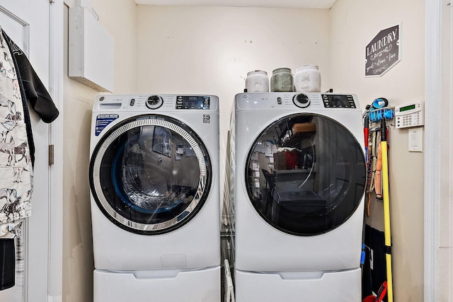 laundry room with washer and clothes dryer