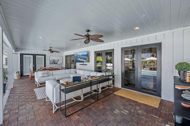 view of patio featuring a ceiling fan, french doors, and an outdoor hangout area