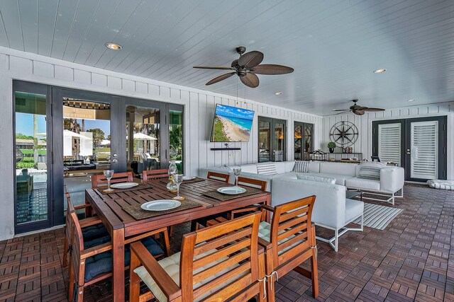 exterior space with french doors, ceiling fan, and an outdoor living space