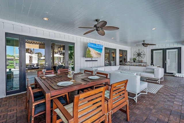 view of patio featuring a ceiling fan, french doors, and an outdoor hangout area