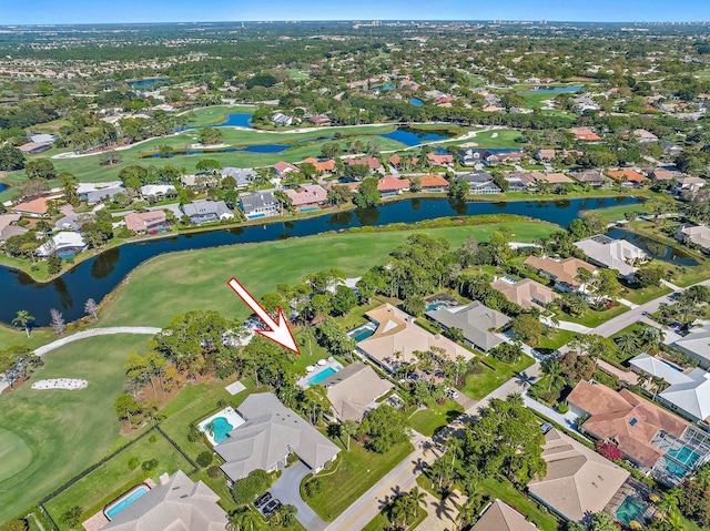 aerial view featuring a water view, a residential view, and golf course view
