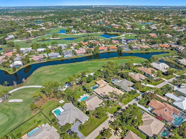 aerial view featuring a water view, a residential view, and golf course view